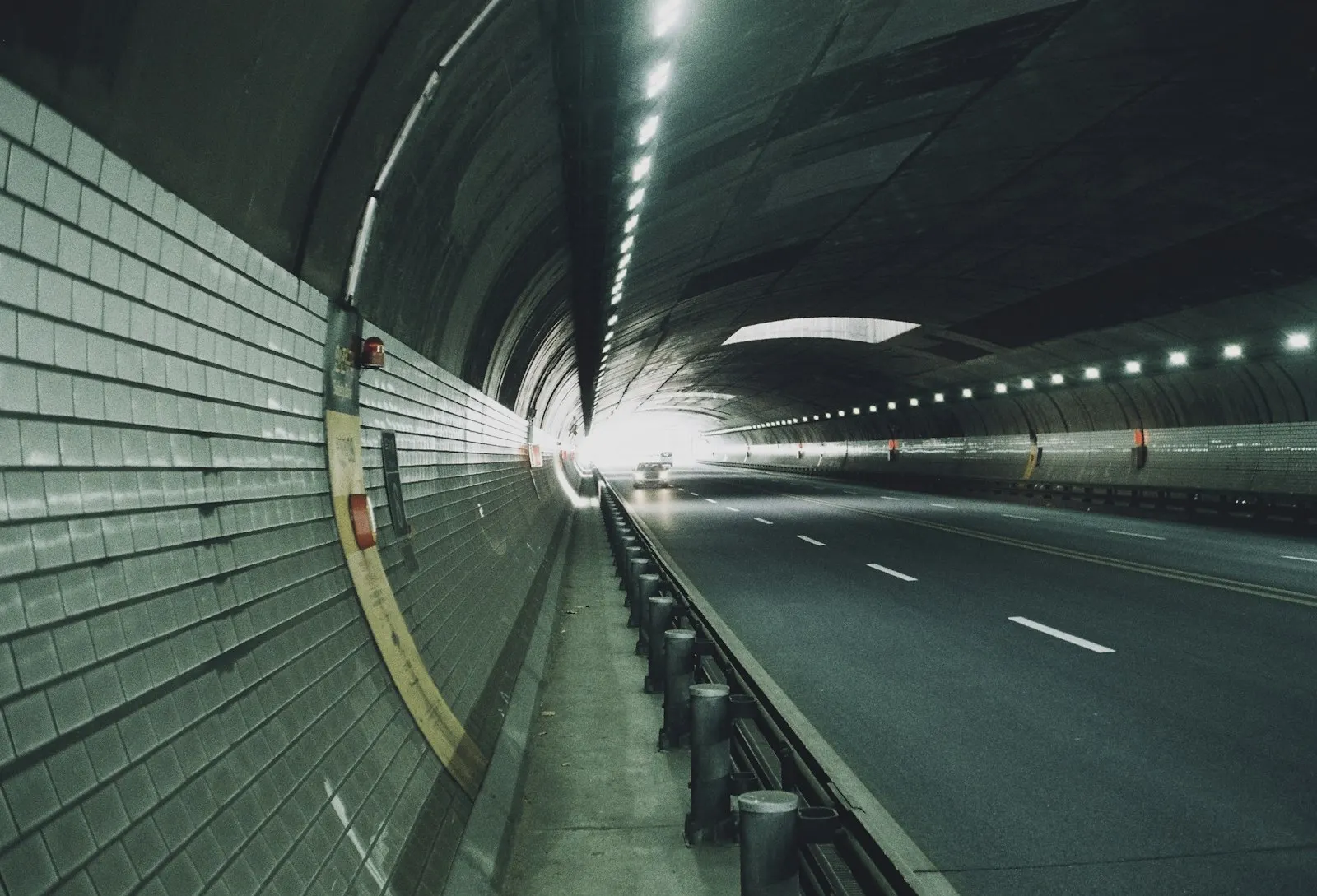 Road tunnel with engineered lighting and ventilation